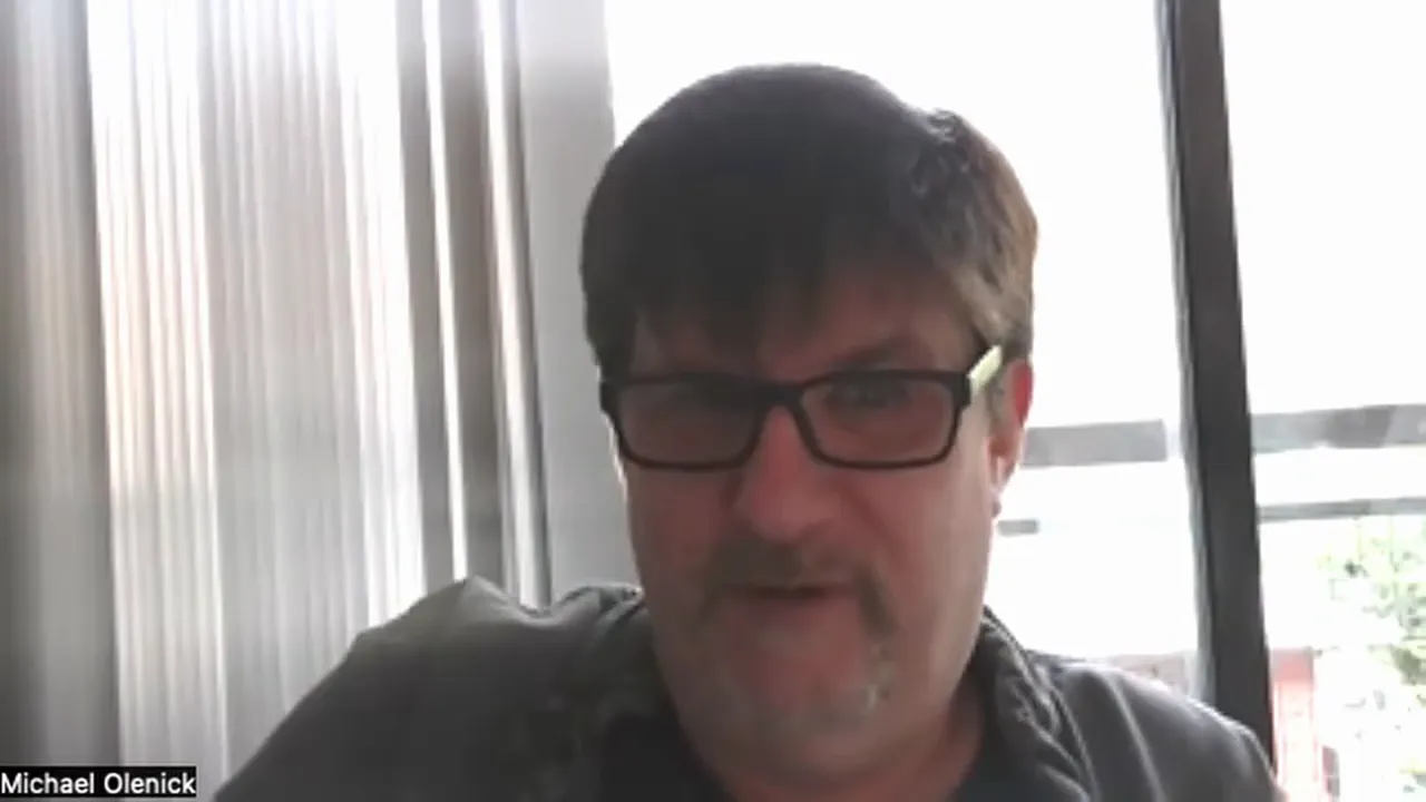 Well-centered video-call presenter with readable face and bright window background.