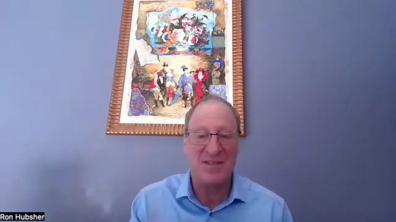 Clear, centered presenter on a virtual call with framed artwork behind them, emphasizing the rule to do discovery before demoing