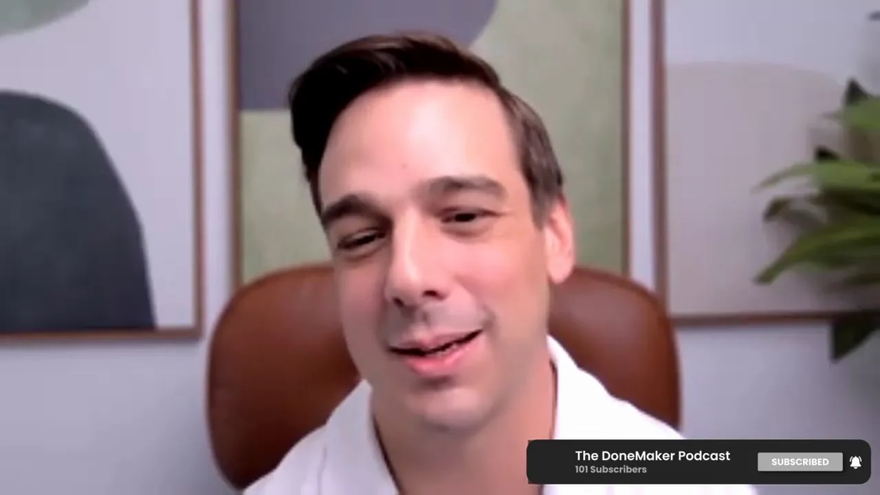 podcast host addressing the camera on a video call while advising on using AI as a tool rather than a replacement