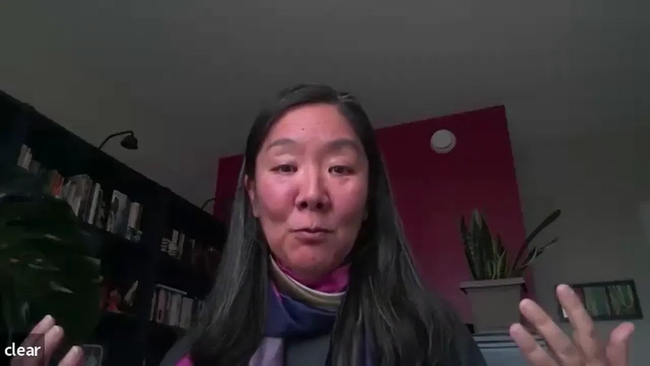 remote leader gesturing with hands during a video call, conveying warmth and clarity