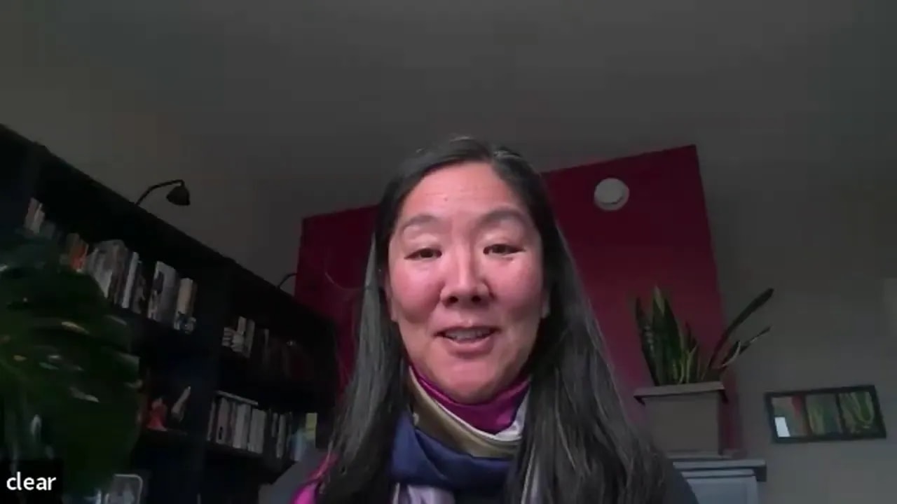 leader telling a story on a video call in a home office, smiling and approachable