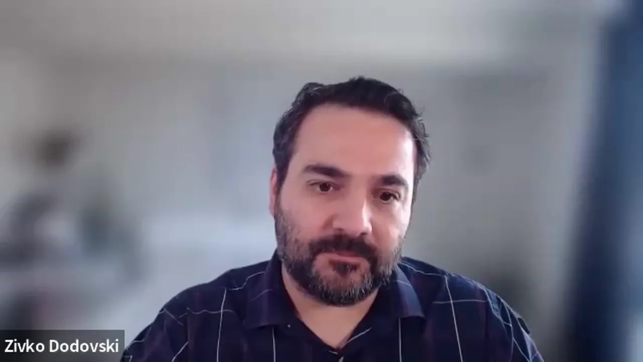 Clear head-and-shoulders shot of a remote presenter on a video call with a softly blurred background