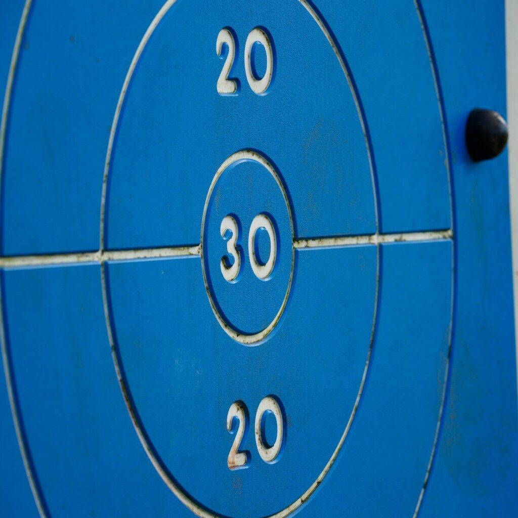a close up of a blue target with numbers on it