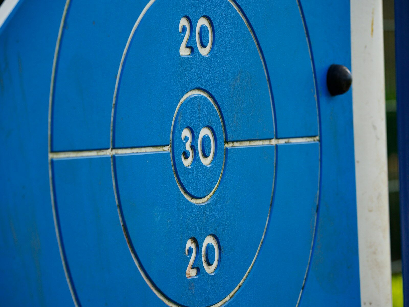 a close up of a blue target with numbers on it
