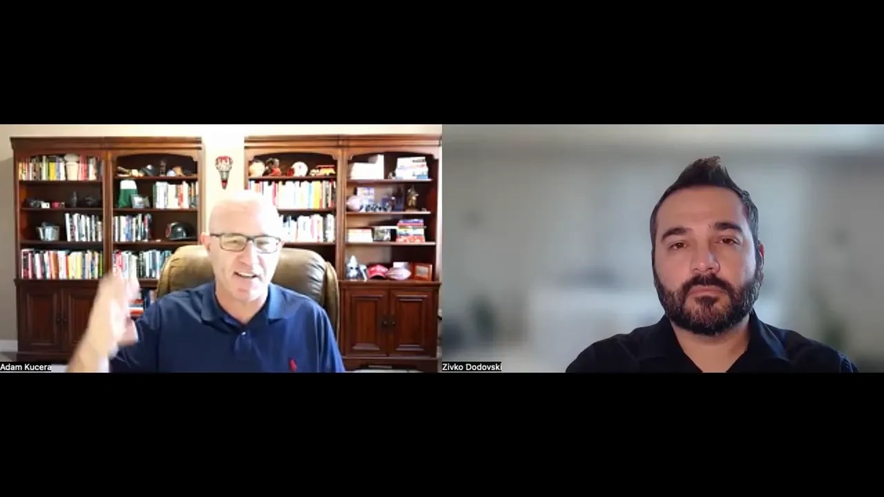 Two participants on a video call, one gesturing while the other listens, illustrating an active cross-functional conversation